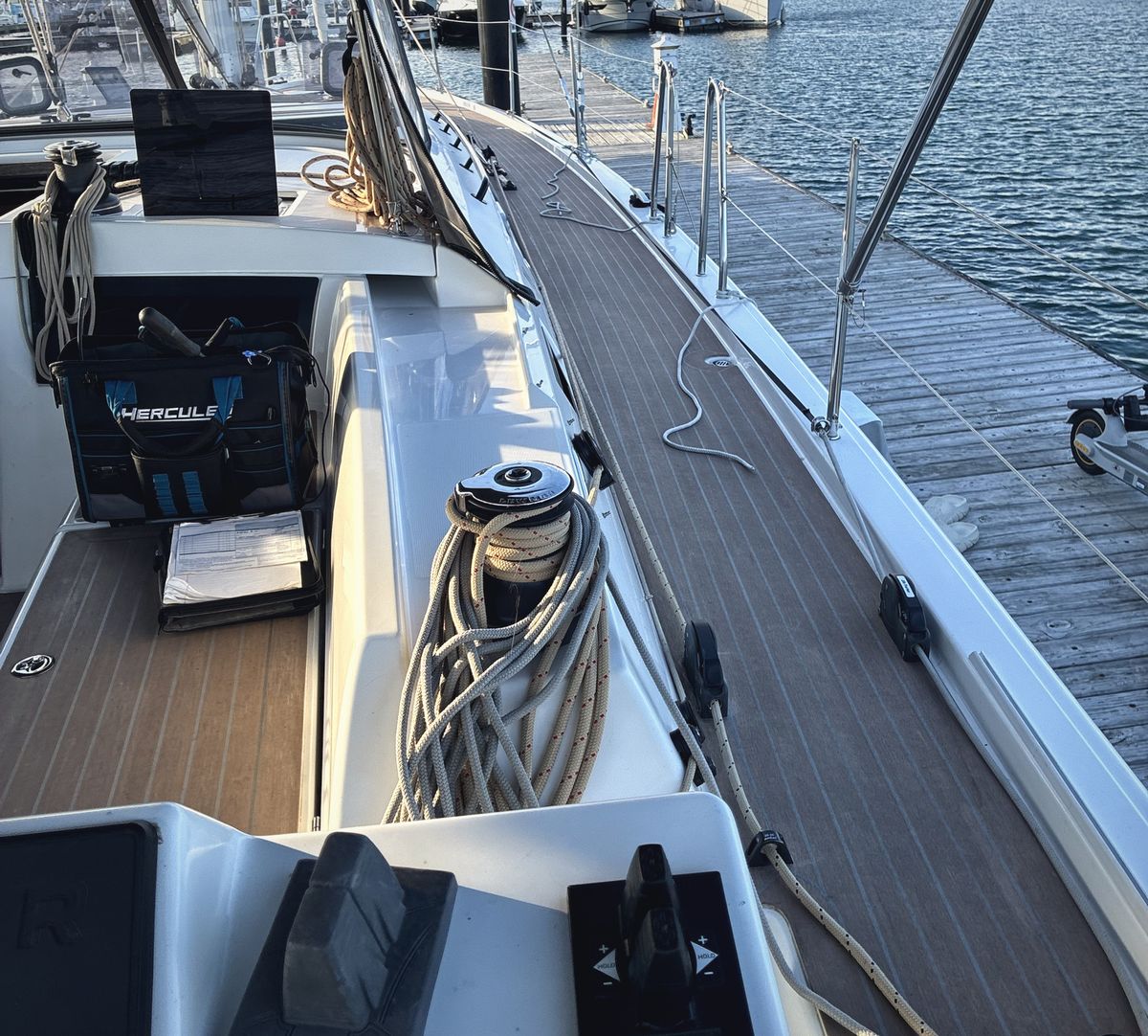 Brad's tool bag and the job paperwork in a sailboat cockpit, tied up at the dock